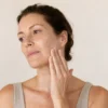 lumiade-pdp-barrier-comfort-sunscreen-lifestyle-clinical-v1 Applying Haru Shield Sunscreen SPF 50+ to face and neck